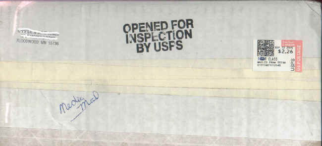 Parcel with "OPENED FOR/INSPECTION/BY USPS" Auxiliary Marking